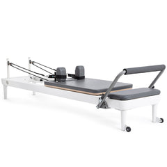 Elina Pilates Nubium aluminum reformer with gray upholstery, angled view