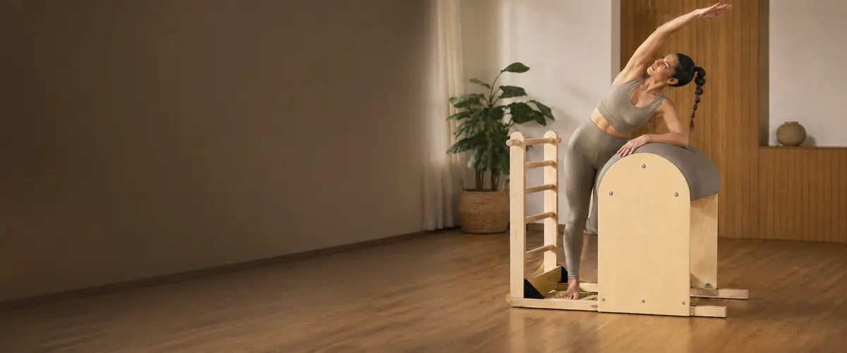 Woman training on an Elina Pilates Ladder Barrel