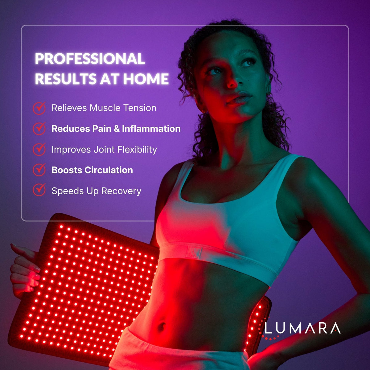 Woman holding the Lumara Pad for a body focused recovery routine