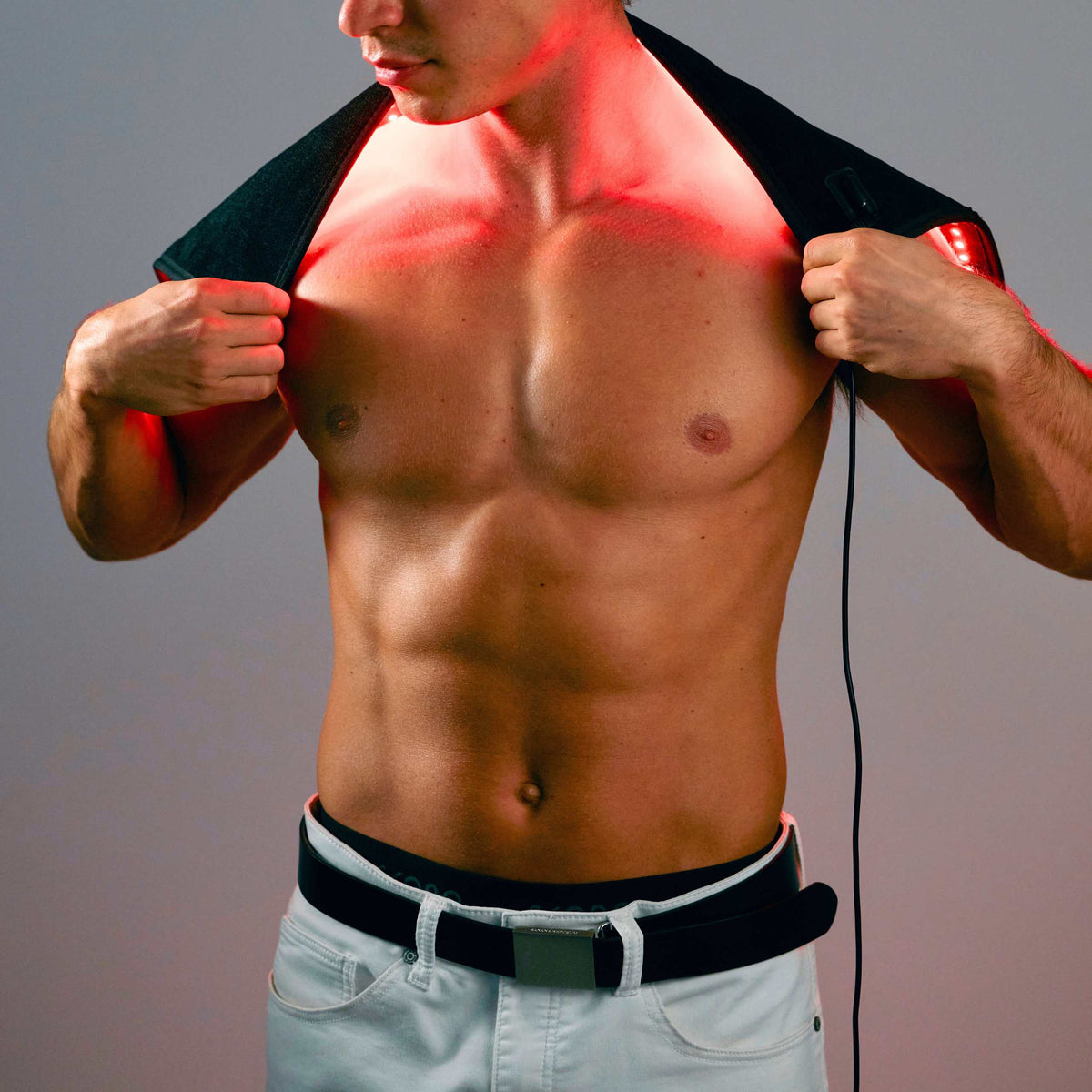 Man using the Lumara Pad across his upper back