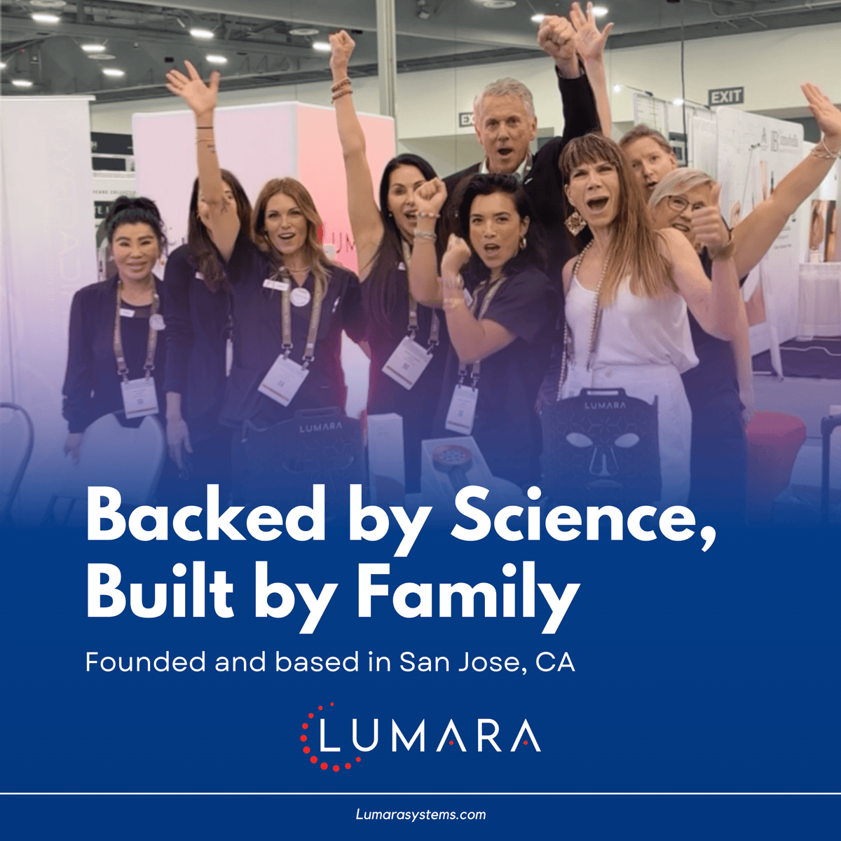 Lumara team celebrating at a light therapy trade show booth