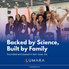 Lumara team celebrating at a light therapy trade show booth