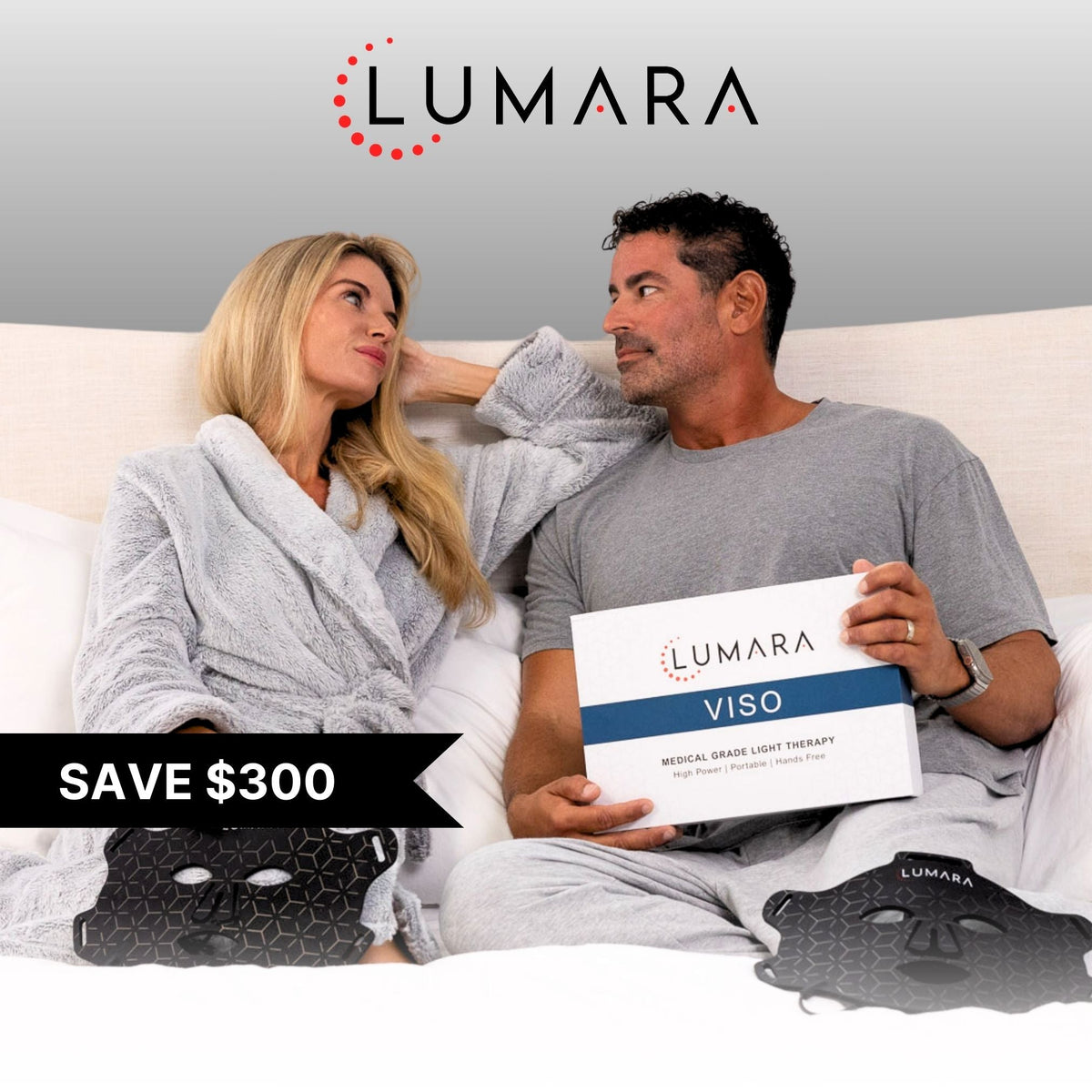 Couple holding the Lumara VISO product box at home