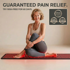 women sitting down on the red light therapy pad