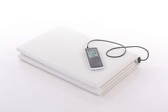 OMI PADS PEMF mat folded for storage with controller