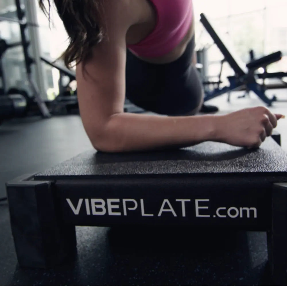 Side view of the VibePlate 2424 with the optional Small Balance Bar