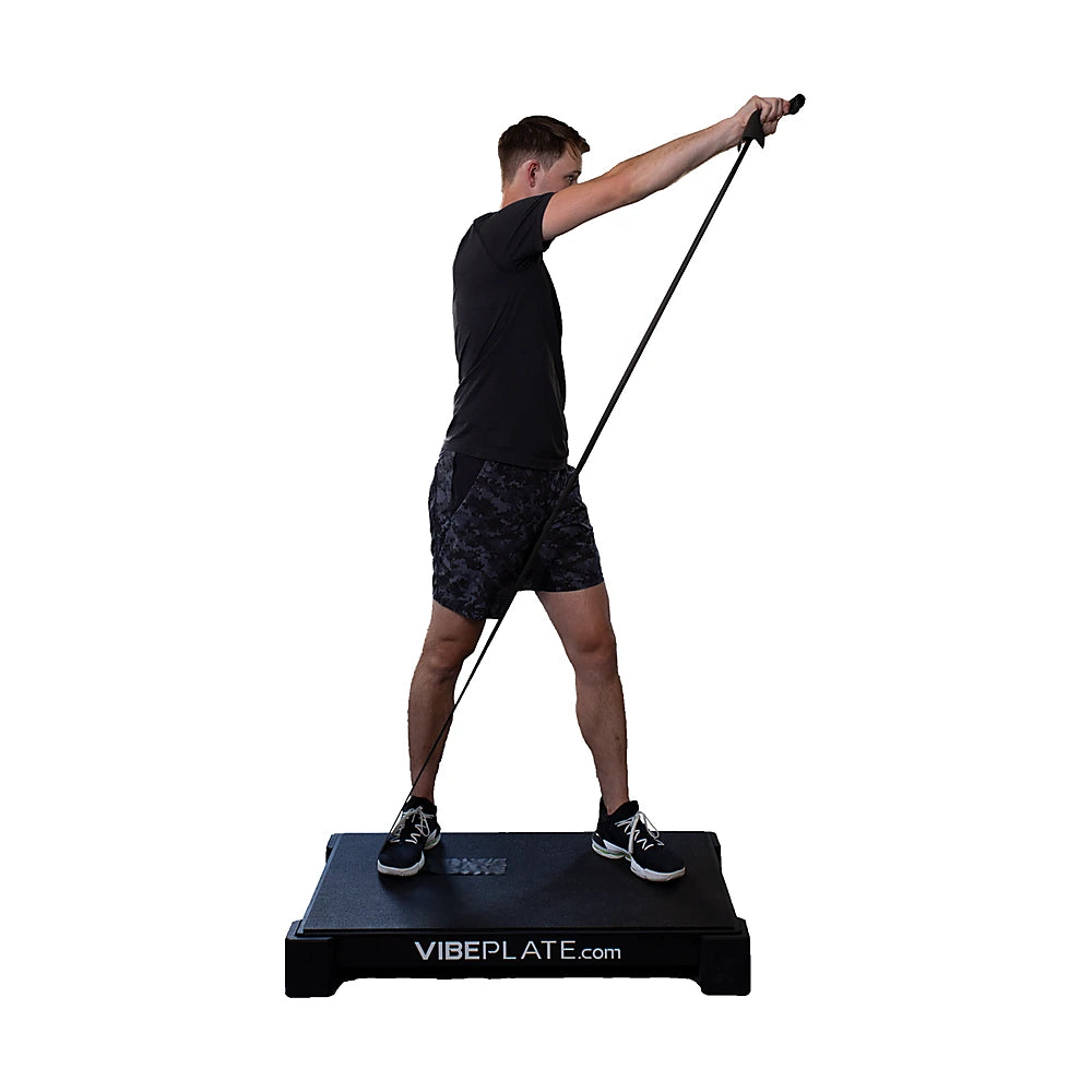 Man using resistance bands while standing on the VibePlate 2440
