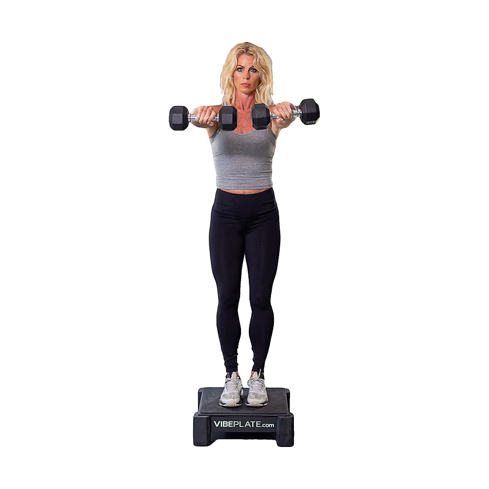 Woman exercising with dumbbells on the VibePlate Mini