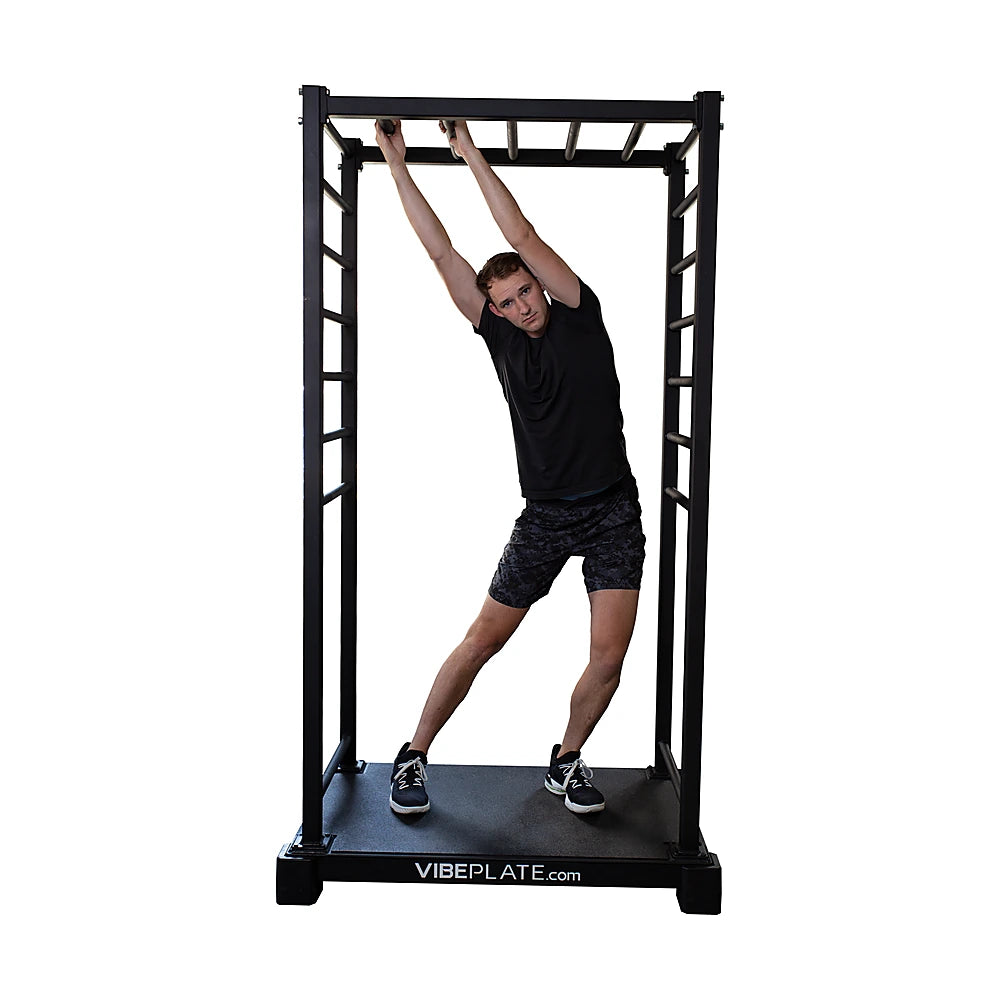 Man performing a side stretch on the VibeStretch platform